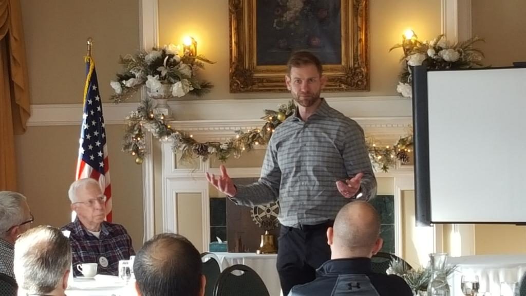 Grant Potulny addressing the members of the Marquette West Rotary.