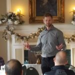 Grant Potulny addressing the members of the Marquette West Rotary.