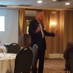 Dr. Brian Zinser talking to Rotarians at the Landmark Inn.