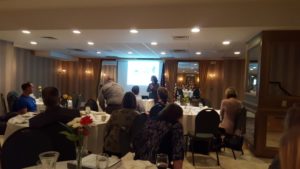 Library Director Andrea Ingmire talking at the Landmark Inn during the weekly luncheon.